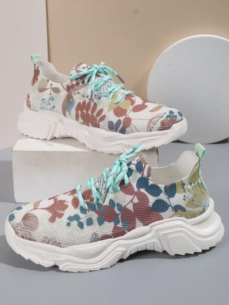 Ademende vetersneakers met bloemenprint