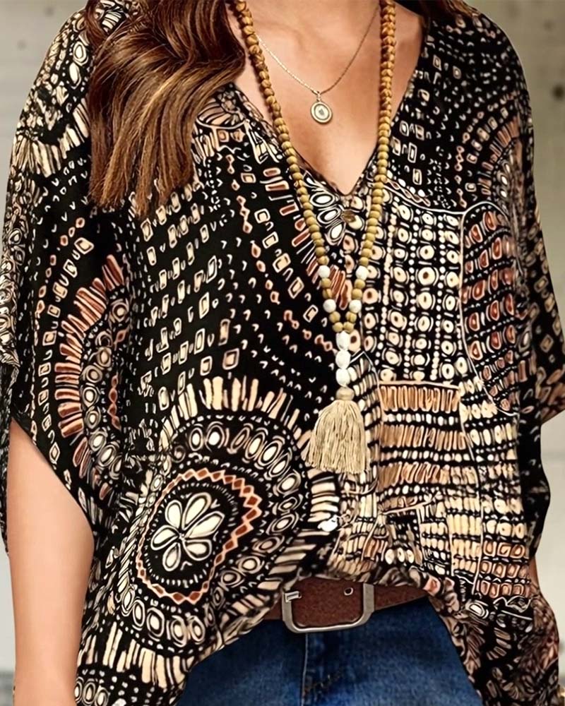Bedrukte V-hals blouse met vleermuismouwen