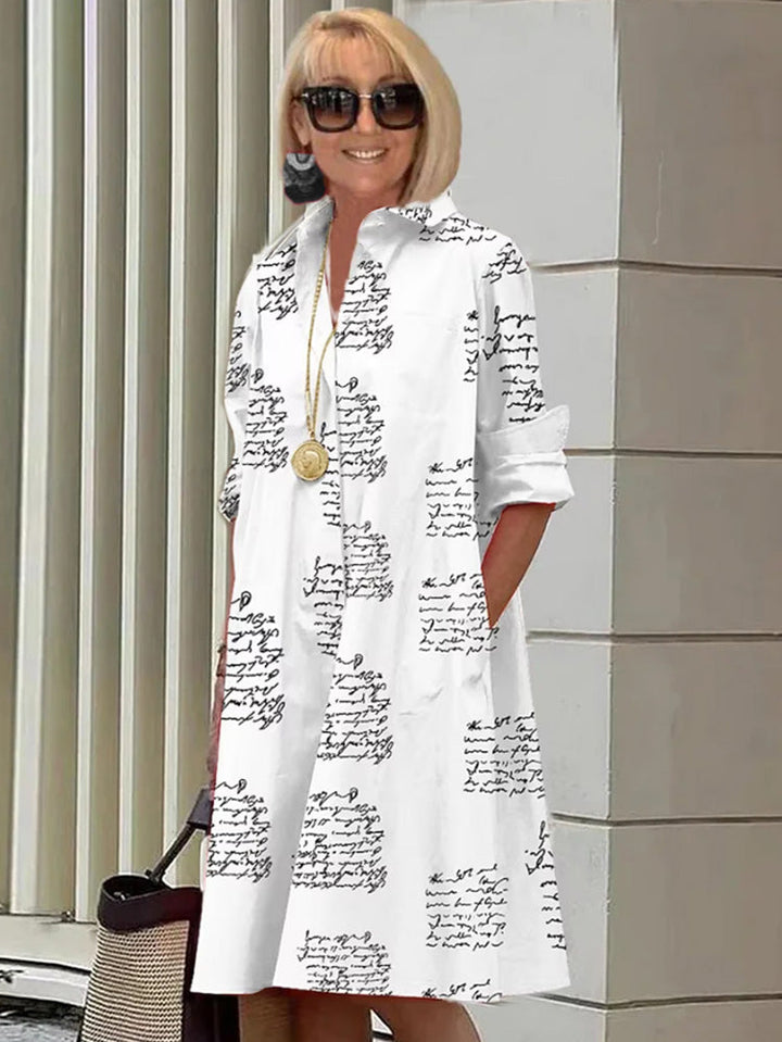 Stijlvolle jurk met letterprint en zakken