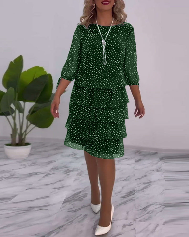 elegante gelaagde jurk met polkadotprint