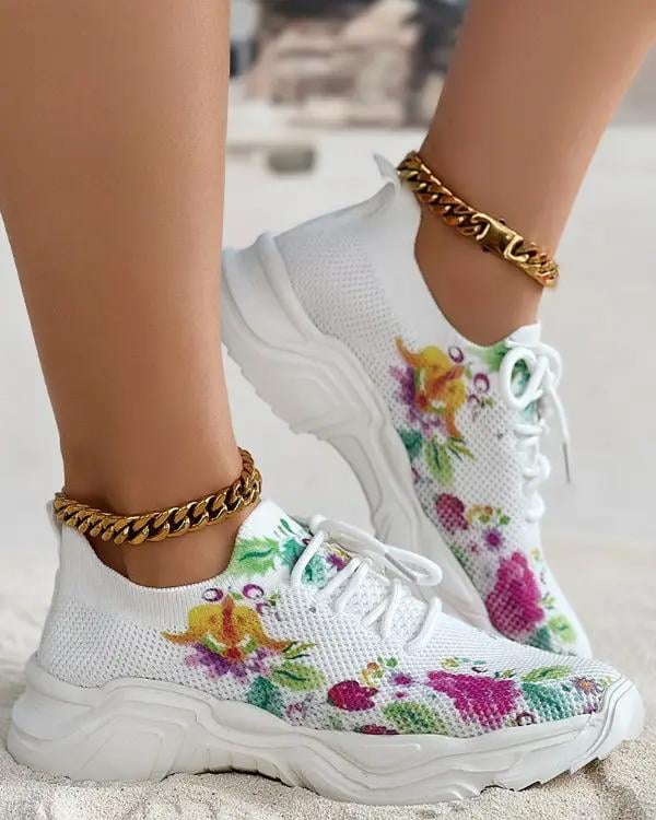 Ademende vetersneakers met bloemenprint