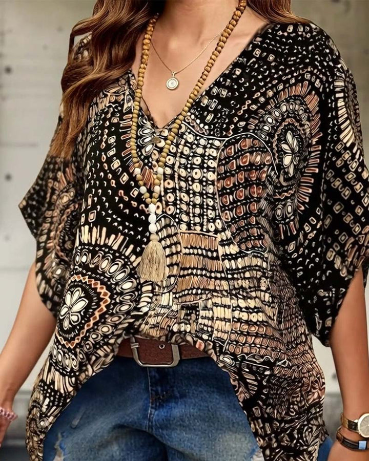 Bedrukte V-hals blouse met vleermuismouwen