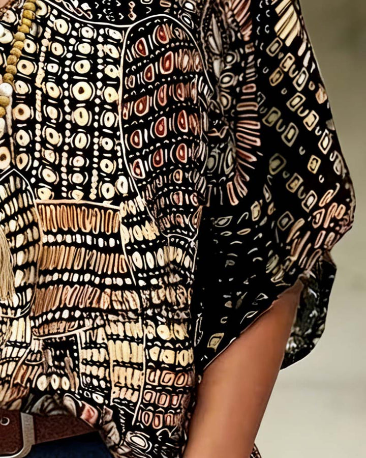 Bedrukte V-hals blouse met vleermuismouwen