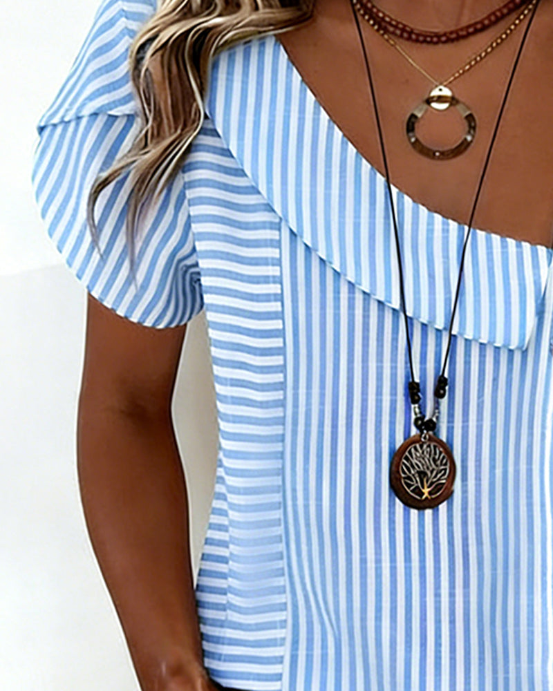 Asymmetrische blouse met gestreepte pofmouwen
