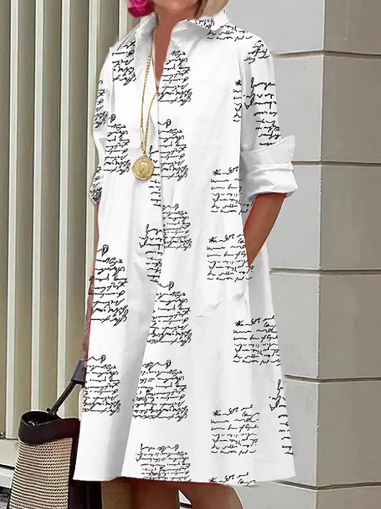 Stijlvolle jurk met letterprint en zakken