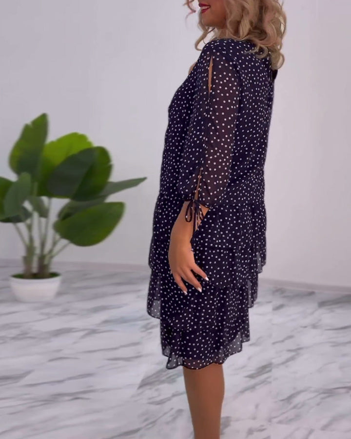elegante gelaagde jurk met polkadotprint