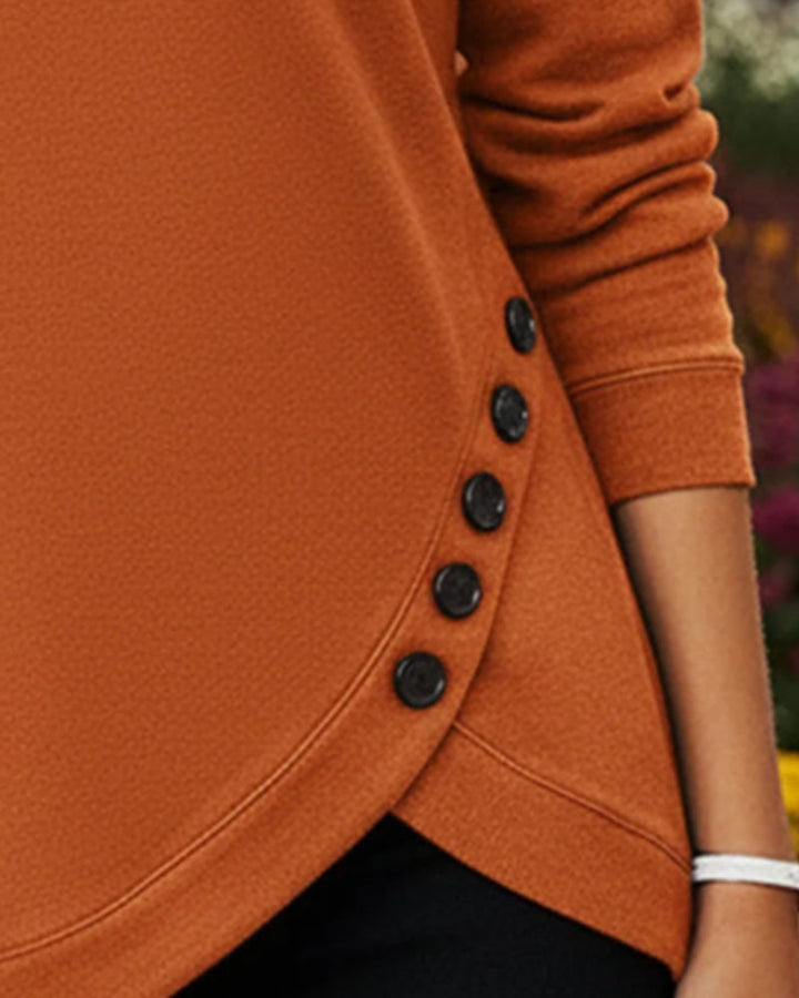 Top met knoopsluiting en asymmetrische zoom