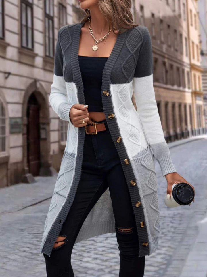 Kabelgebreide longline V-hals cardigan met colour block