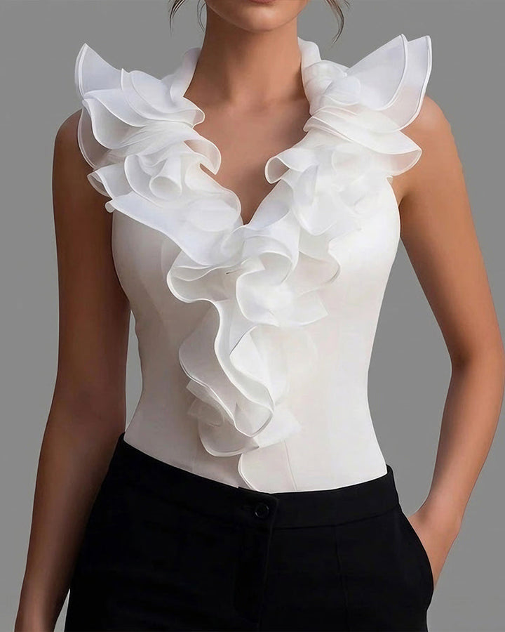 Mouwloze blouse met V-hals en lotusbladzoom