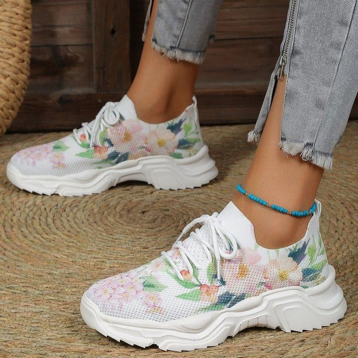 Ademende vetersneakers met bloemenprint