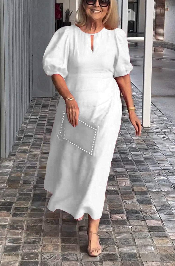 Elegante jurk met opvallende pofmouwen