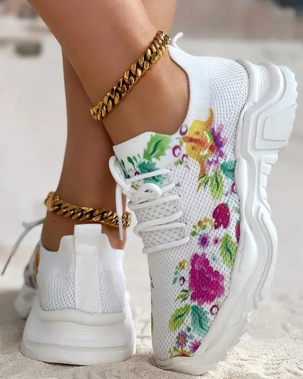 Ademende vetersneakers met bloemenprint