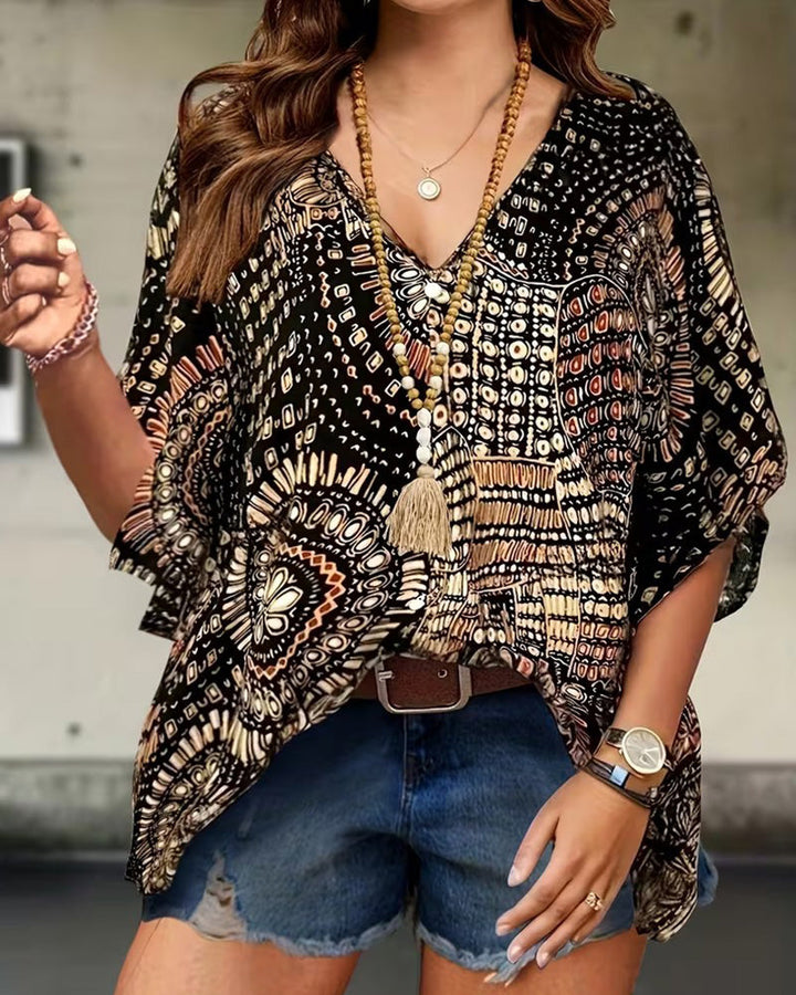 Bedrukte V-hals blouse met vleermuismouwen