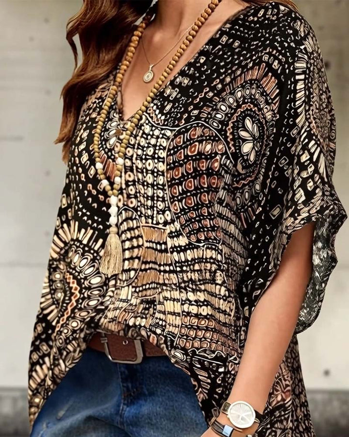 Bedrukte V-hals blouse met vleermuismouwen