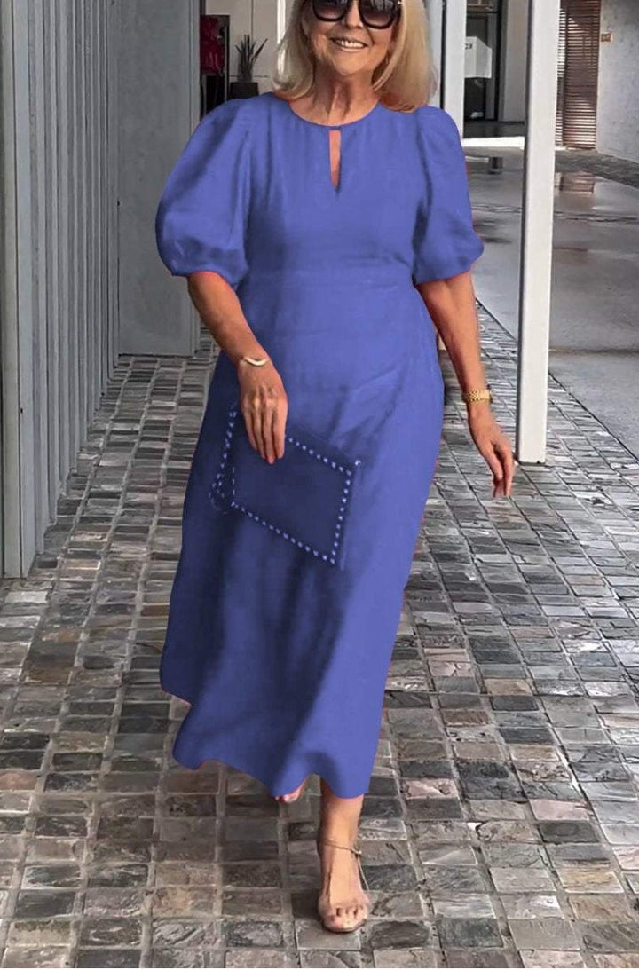 Elegante jurk met opvallende pofmouwen