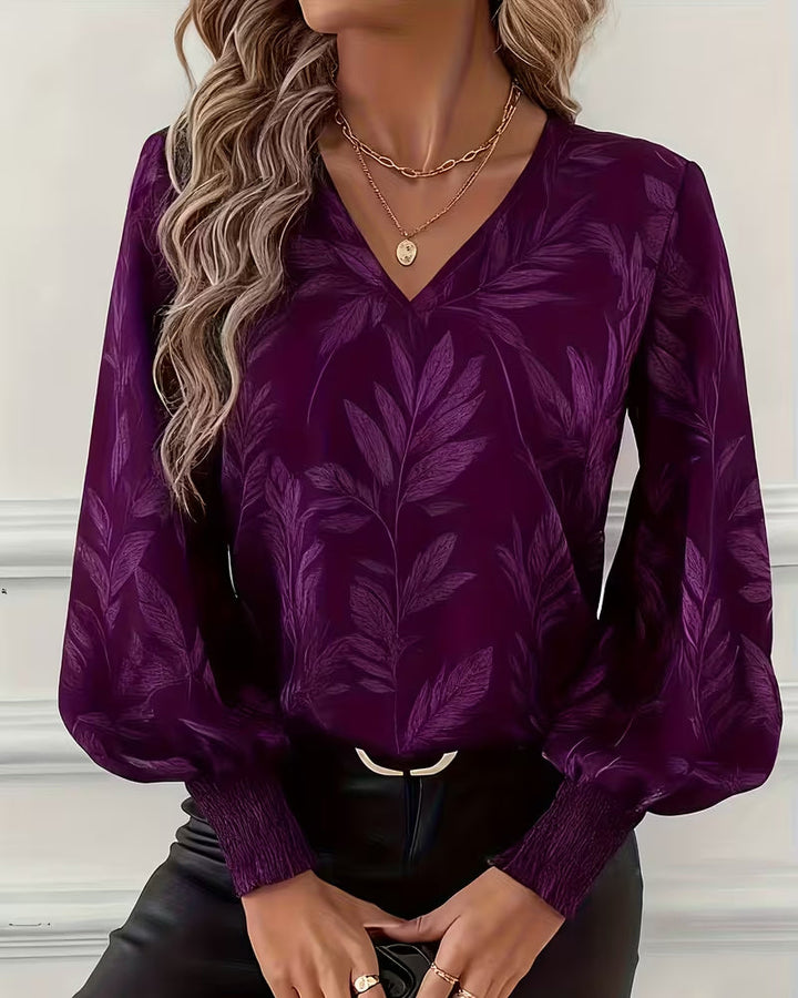 V-hals blouse met lange mouwen en bladmotief
