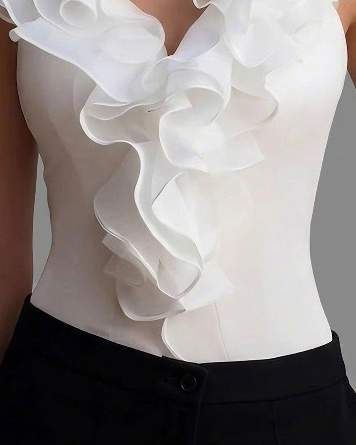 Mouwloze blouse met V-hals en lotusbladzoom