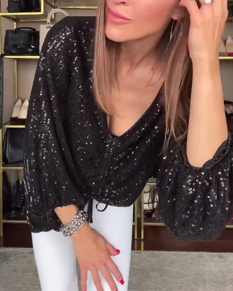 V-hals shirt met lampionmouwen en pailletten