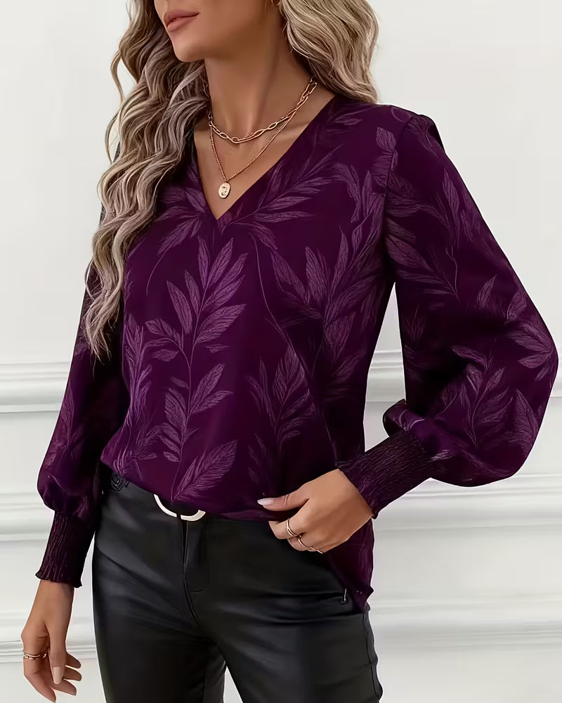 V-hals blouse met lange mouwen en bladmotief