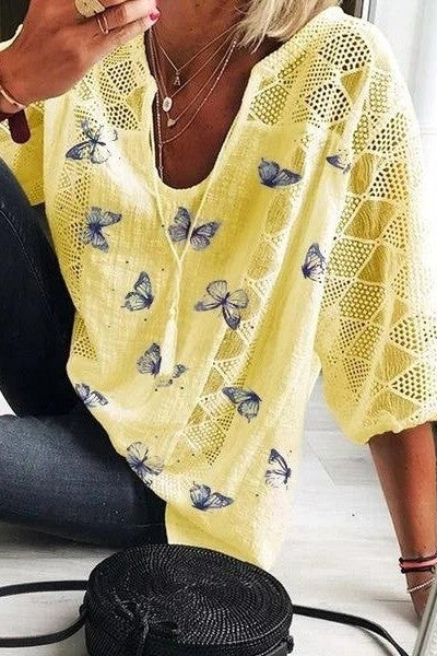 Damesblouse met vlinderprint en V-hals