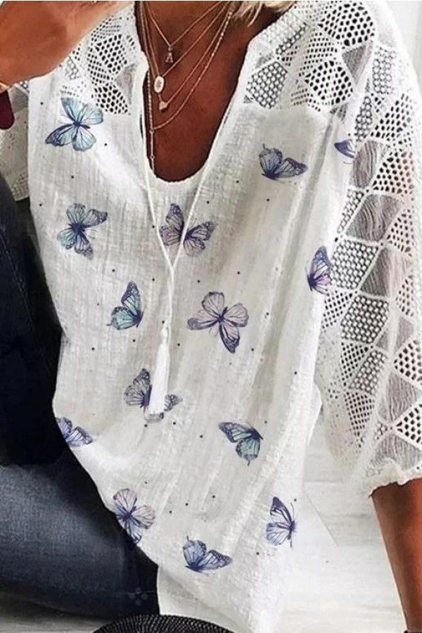 Damesblouse met vlinderprint en V-hals